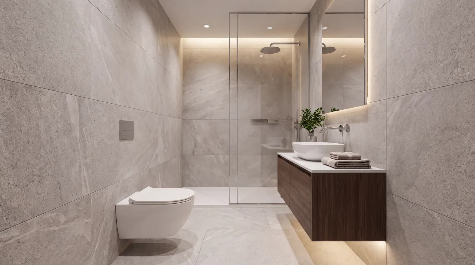 Kleine badkamer met hangtoilet, zwevend meubel en een glazen douchewand